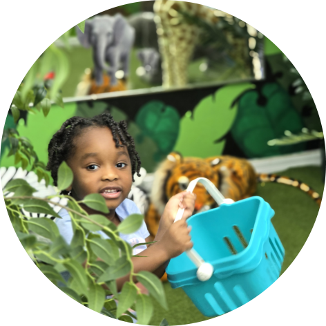 A young girl with braided hair holding a blue basket